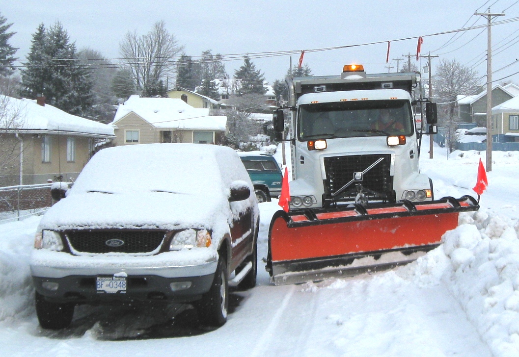 Snow Plow trying to get by parked car