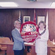 Mayor of Abashiri presenting Mayor of Port Alberni with a gift